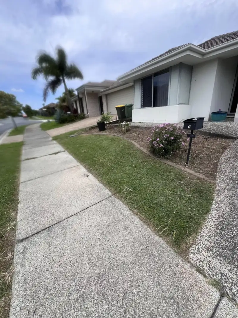 Weed-free tidy lawn and footpath at a Moreton Bay home after lawn weed control