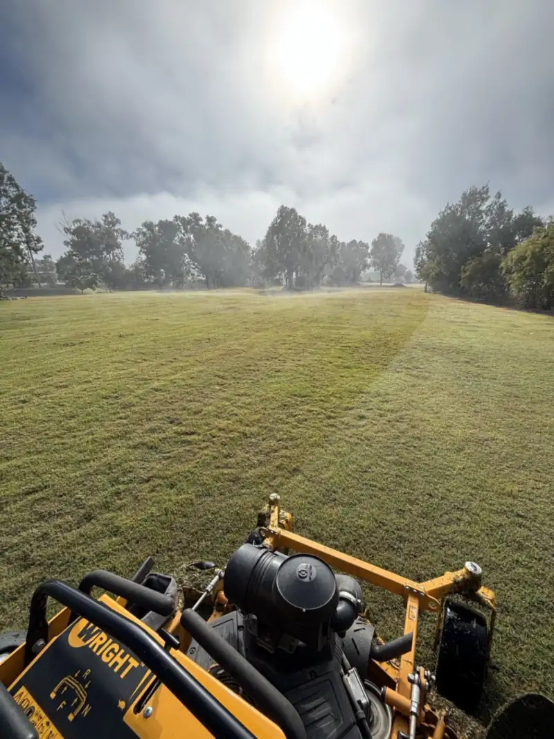 Zero-turn mower on a large lawn on the Caboolture acreage fringe